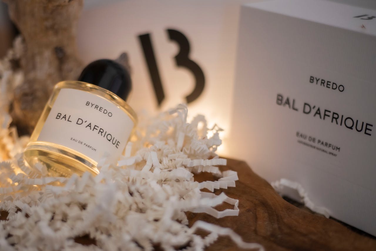 gallery-6 Luxurious Byredo Bal D'Afrique Eau de Parfum framed in a sophisticated still life scene.