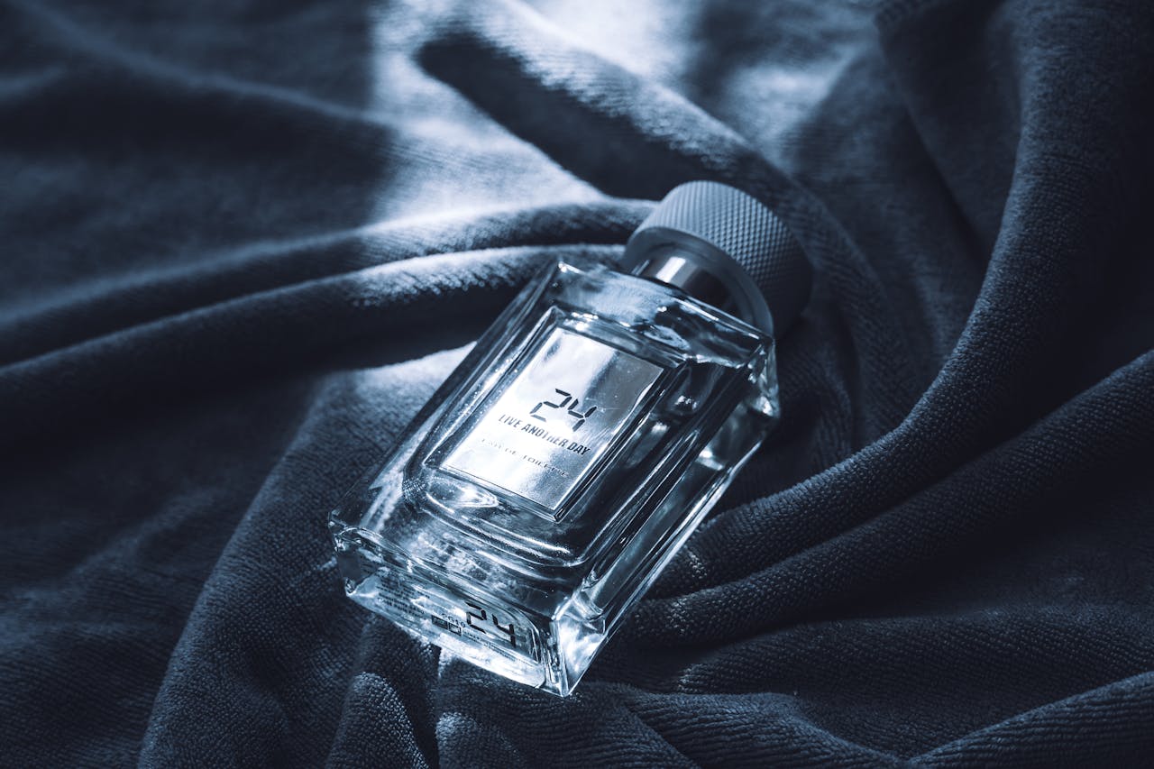 gallery-2 Luxury perfume bottle displayed elegantly on soft fabric, showcasing sophistication and style.